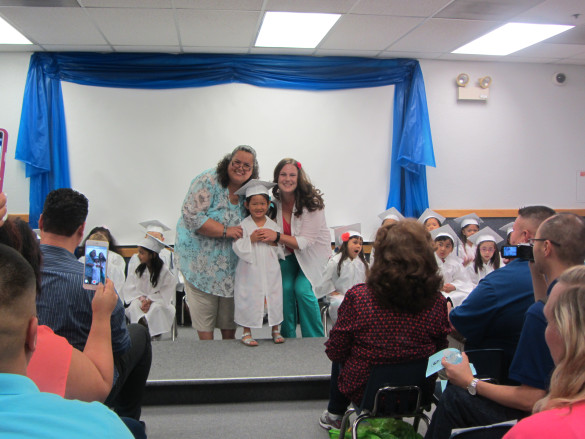Roxy at her Merryhill Preschool Graduation with her teachers Miss Debbie and Miss Melanie