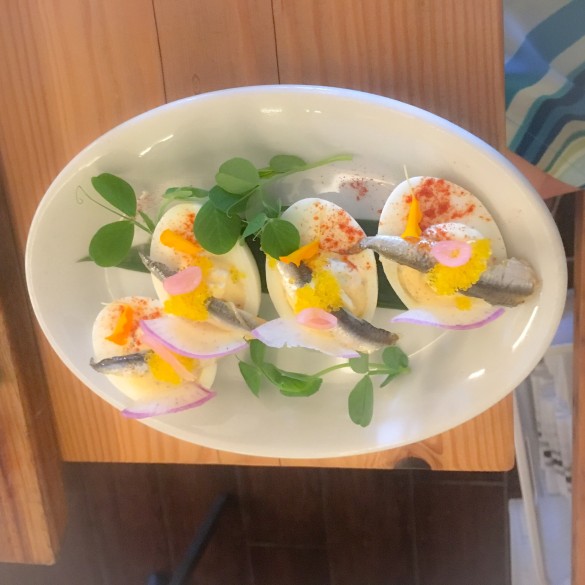Deviled Eggs with Boqurones, yuzu tobiko, and aji amarillo sauce